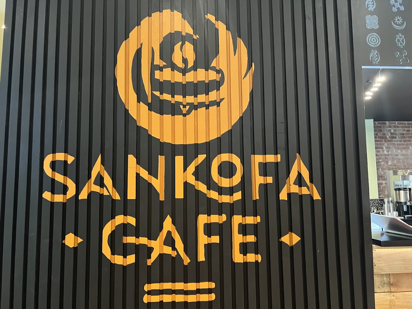 Tables and artwork inside Sankofa Cafe