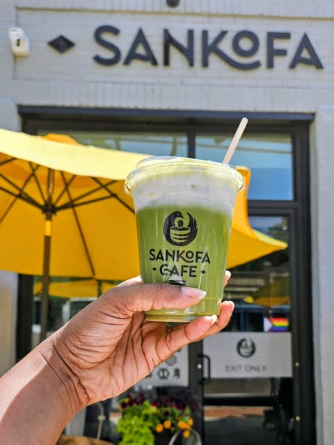 Iced pistachio matcha outside Sankofa Cafe